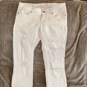 Distressed off-white skinny jeans